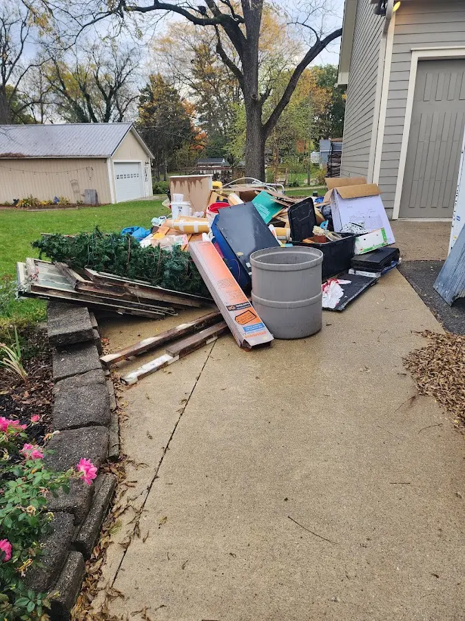 Dumpster being loaded with debris for 30 Yard Dumpster Rental in Radcliff